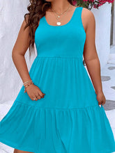  Plus size scoop neck tank dress featuring a flowing tiered skirt design.