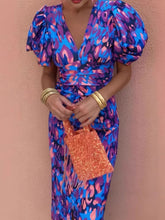 Detailed close up view of the elastic cuffs on a Full Size V-Neck Puff Sleeve Midi Dress Plus Size