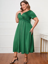  Honey plus size surplice neck midi dress with short sleeves and a flattering faux-wrap bodice.