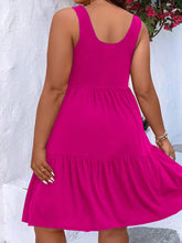  Plus size scoop neck tank dress featuring a flowing tiered skirt design.