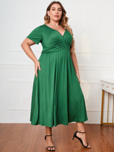  Honey plus size surplice neck midi dress with short sleeves and a flattering faux-wrap bodice.