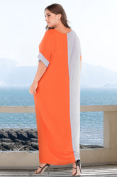 Plus size tee dress with pockets featuring a modern color block design and short sleeves.