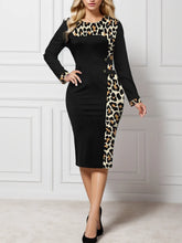 Close up look at the neat crew neckline stitching on the Plus Size Leopard Round Neck Long Sleeve Dress