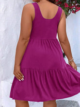  Plus size scoop neck tank dress featuring a flowing tiered skirt design.