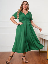  Honey plus size surplice neck midi dress with short sleeves and a flattering faux-wrap bodice.