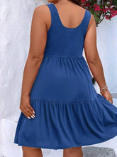  Plus size scoop neck tank dress featuring a flowing tiered skirt design.