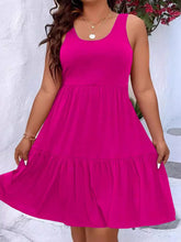  Plus size scoop neck tank dress featuring a flowing tiered skirt design.
