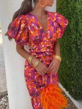 Detailed close up view of the elastic cuffs on a Full Size V-Neck Puff Sleeve Midi Dress Plus Size