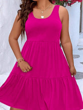  Plus size scoop neck tank dress featuring a flowing tiered skirt design.