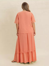  Plus size lace top and skirt set featuring intricate lace paneling and a chic tie neck.