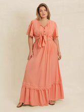  Plus size lace top and skirt set featuring intricate lace paneling and a chic tie neck.