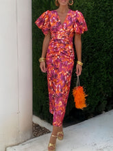 Detailed close up view of the elastic cuffs on a Full Size V-Neck Puff Sleeve Midi Dress Plus Size