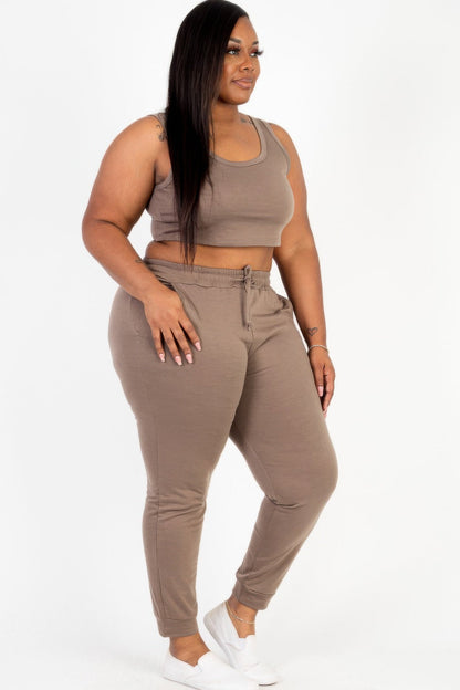  Model posing in a heather gray plus size French terry cropped tank top &amp; joggers set