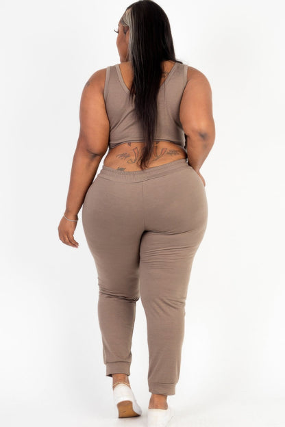  Model posing in a heather gray plus size French terry cropped tank top &amp; joggers set