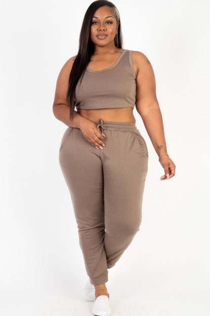  Model posing in a heather gray plus size French terry cropped tank top &amp; joggers set