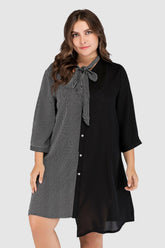  Plus size tie-neck dress featuring a modern striped color block pattern and adjustable neck tie.
