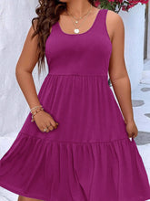  Plus size scoop neck tank dress featuring a flowing tiered skirt design.