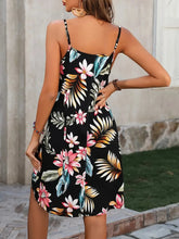 Close up view of the adjustable shoulder strap sliders on a Plus Size Printed V-Neck Cami Dress