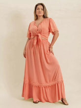  Plus size lace top and skirt set featuring intricate lace paneling and a chic tie neck.