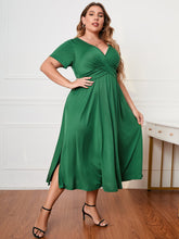 Honey plus size surplice neck midi dress with short sleeves and a flattering faux-wrap bodice.