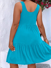  Plus size scoop neck tank dress featuring a flowing tiered skirt design.