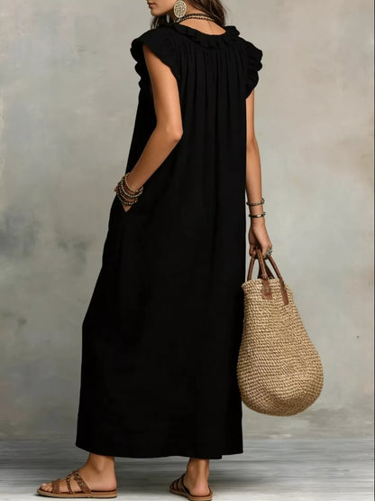Close up of the ruffle detailing on a full size ruffled v-neck cap sleeve maxi dress plus size