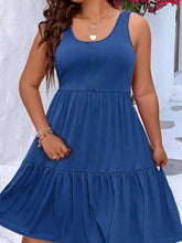  Plus size scoop neck tank dress featuring a flowing tiered skirt design.