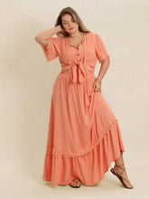  Plus size lace top and skirt set featuring intricate lace paneling and a chic tie neck.