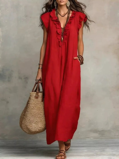 Close up of the ruffle detailing on a full size ruffled v-neck cap sleeve maxi dress plus size