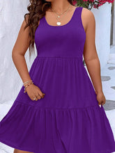  Plus size scoop neck tank dress featuring a flowing tiered skirt design.