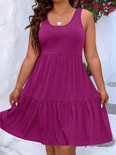  Plus size scoop neck tank dress featuring a flowing tiered skirt design.