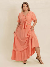  Plus size lace top and skirt set featuring intricate lace paneling and a chic tie neck.