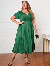 Honey plus size surplice neck midi dress with short sleeves and a flattering faux-wrap bodice.